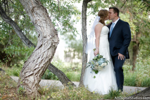 Couple Kissing in the Aspen Ceremony Garden